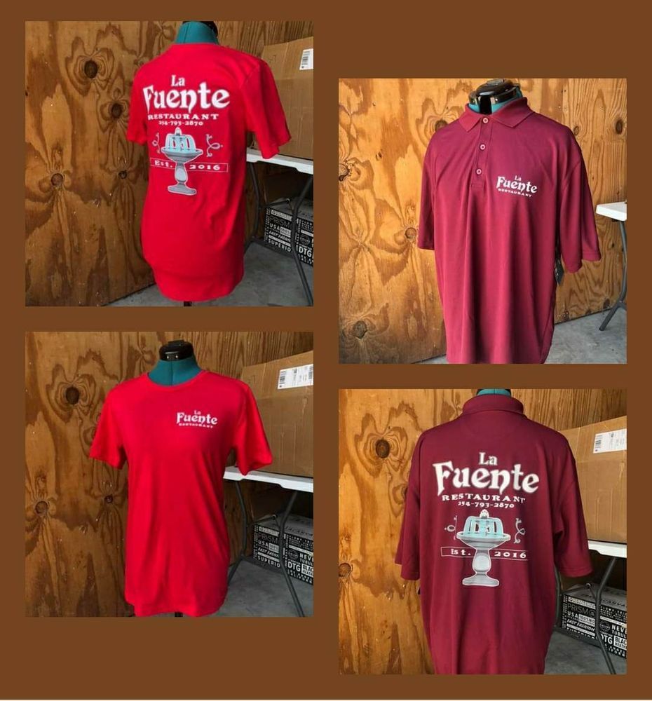 Four maroon and red Fuente T-shirts displayed against a wood wall, showing front and back designs.