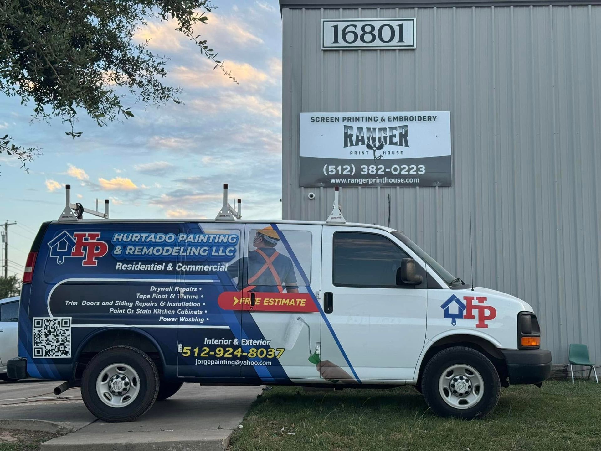 Plumber’s van parked outside a building with sign for Rappier Plumbing & Heating, address 16801 visible.