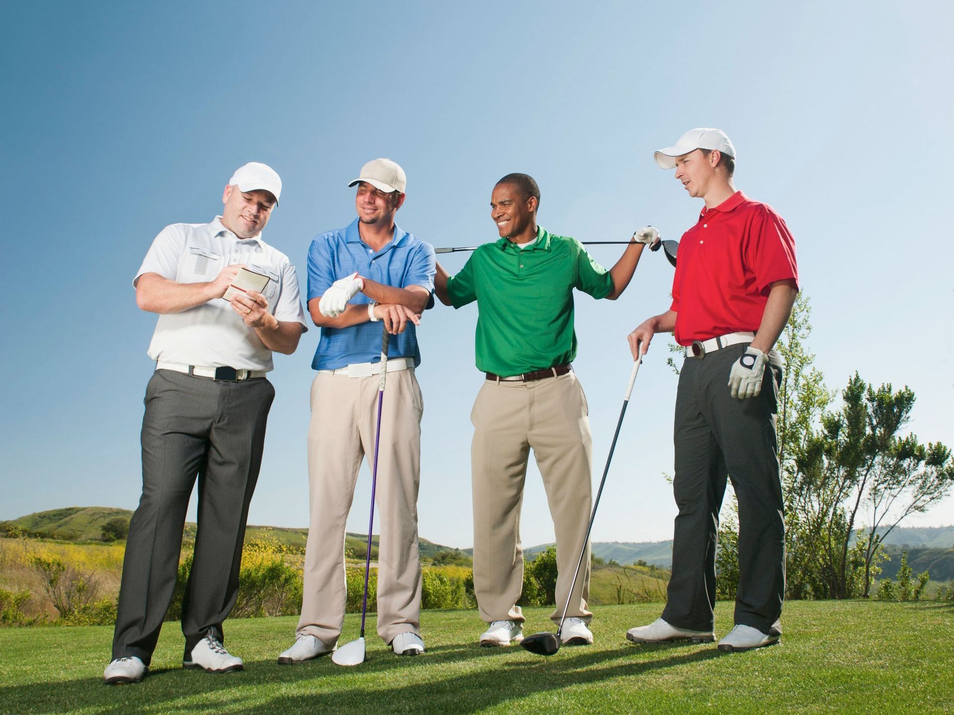 A group of professionally dressed individuals stands confidently in front of a sleek black party bus on a city street, likely in Chicago, Illinois. They exhibit a mix of stylish business and smart casual attire, ready for an event. The image suggests the group is using Rockford Rides Limo service for comfortable and stylish group transportation, enhancing their city experience with the convenience and luxury of a party bus.