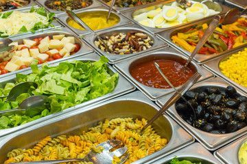Buffet salad bar with salads and condiments