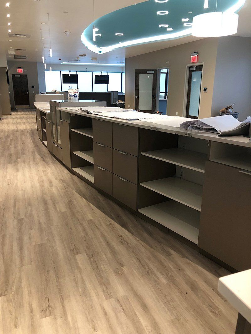 A long hallway with a lot of shelves and cabinets