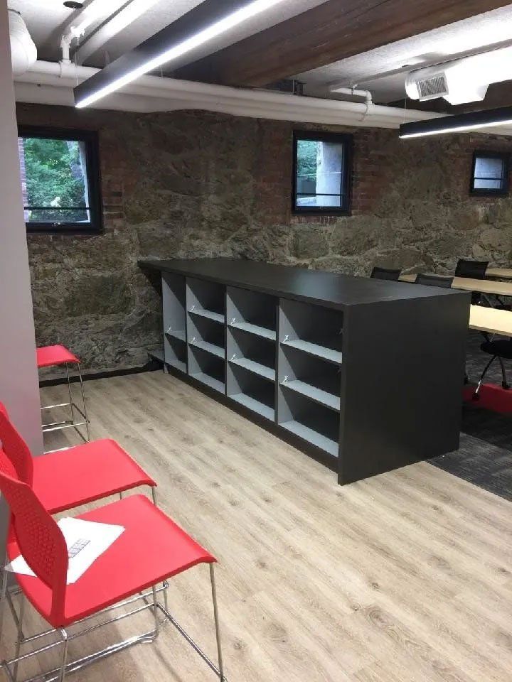 A room with a table and chairs in it