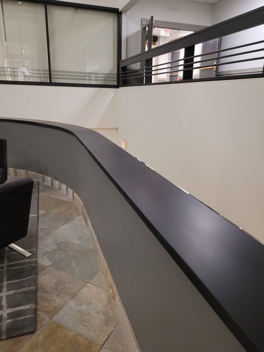A room with a staircase and a chair in it