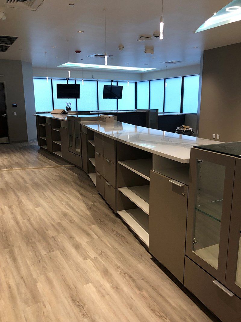 A kitchen with a lot of cabinets and shelves