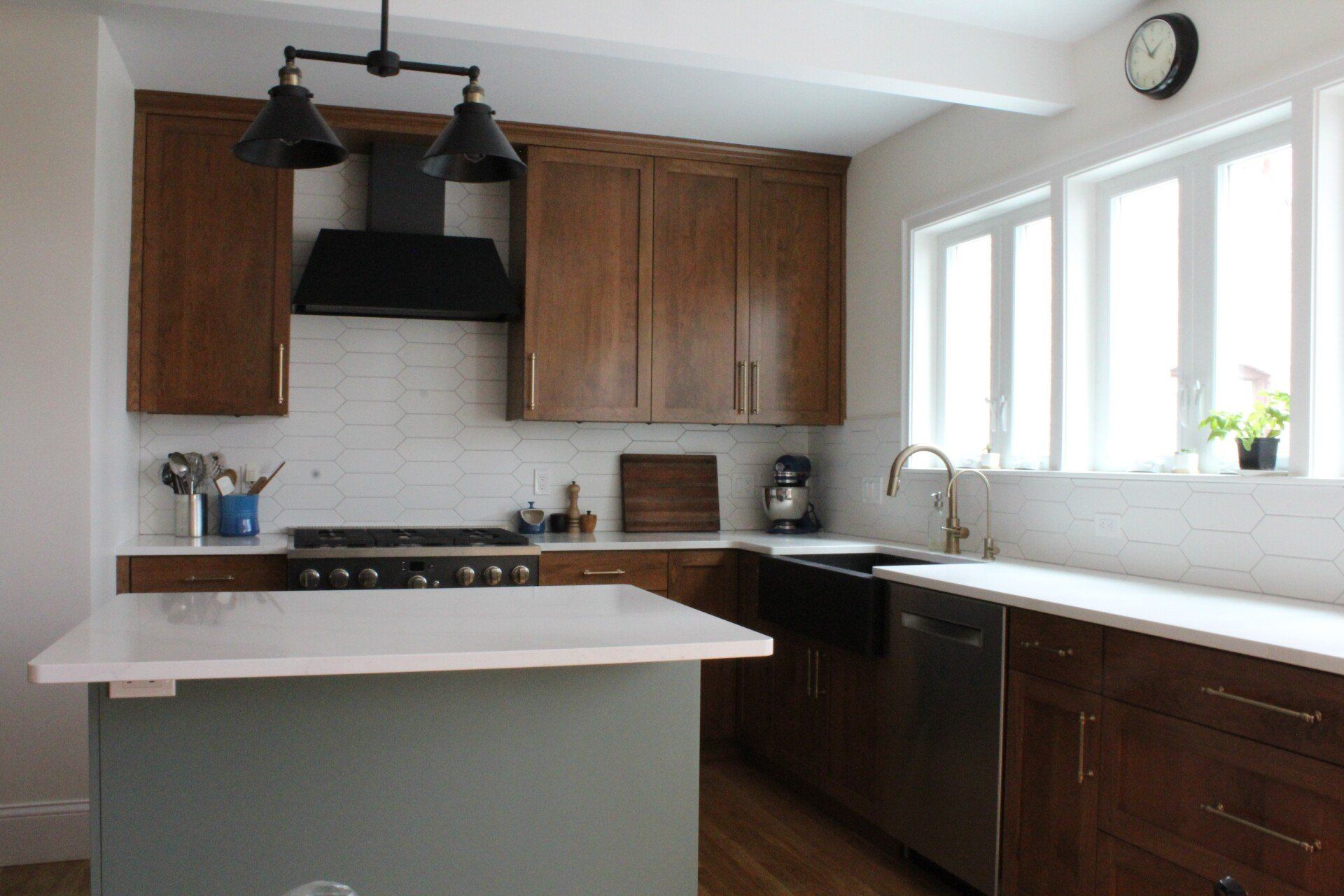 A kitchen with wooden cabinets and stainless steel appliances
