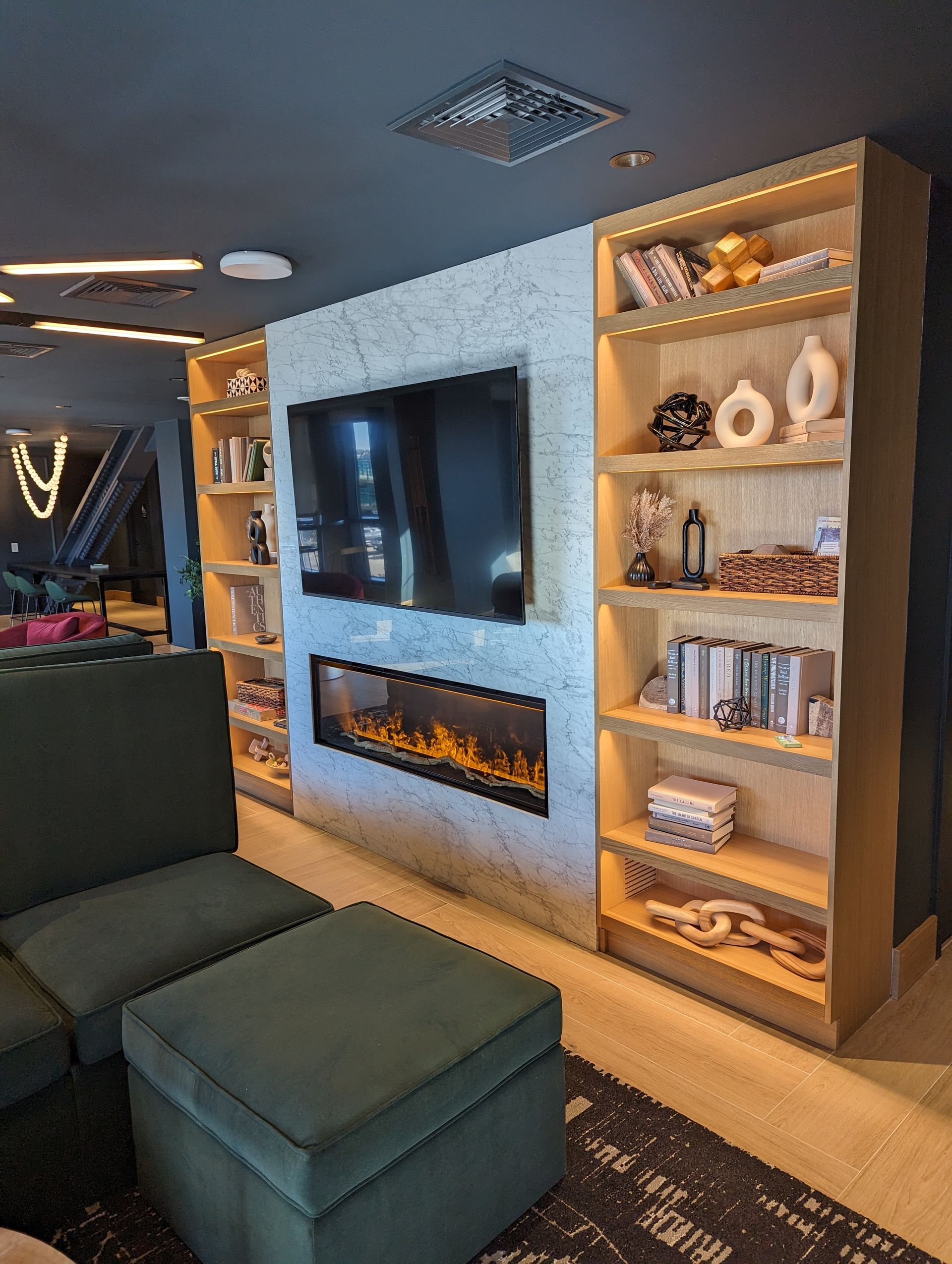 A living room with a fireplace and a flat screen tv.