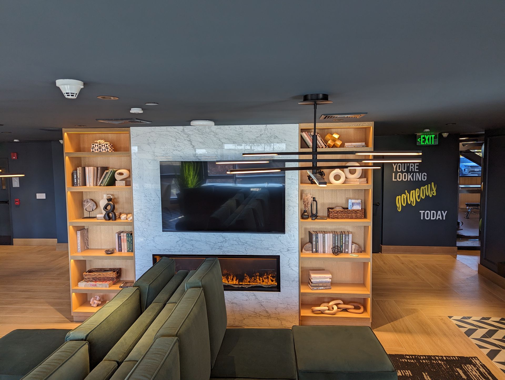 A living room with a fireplace and a flat screen tv