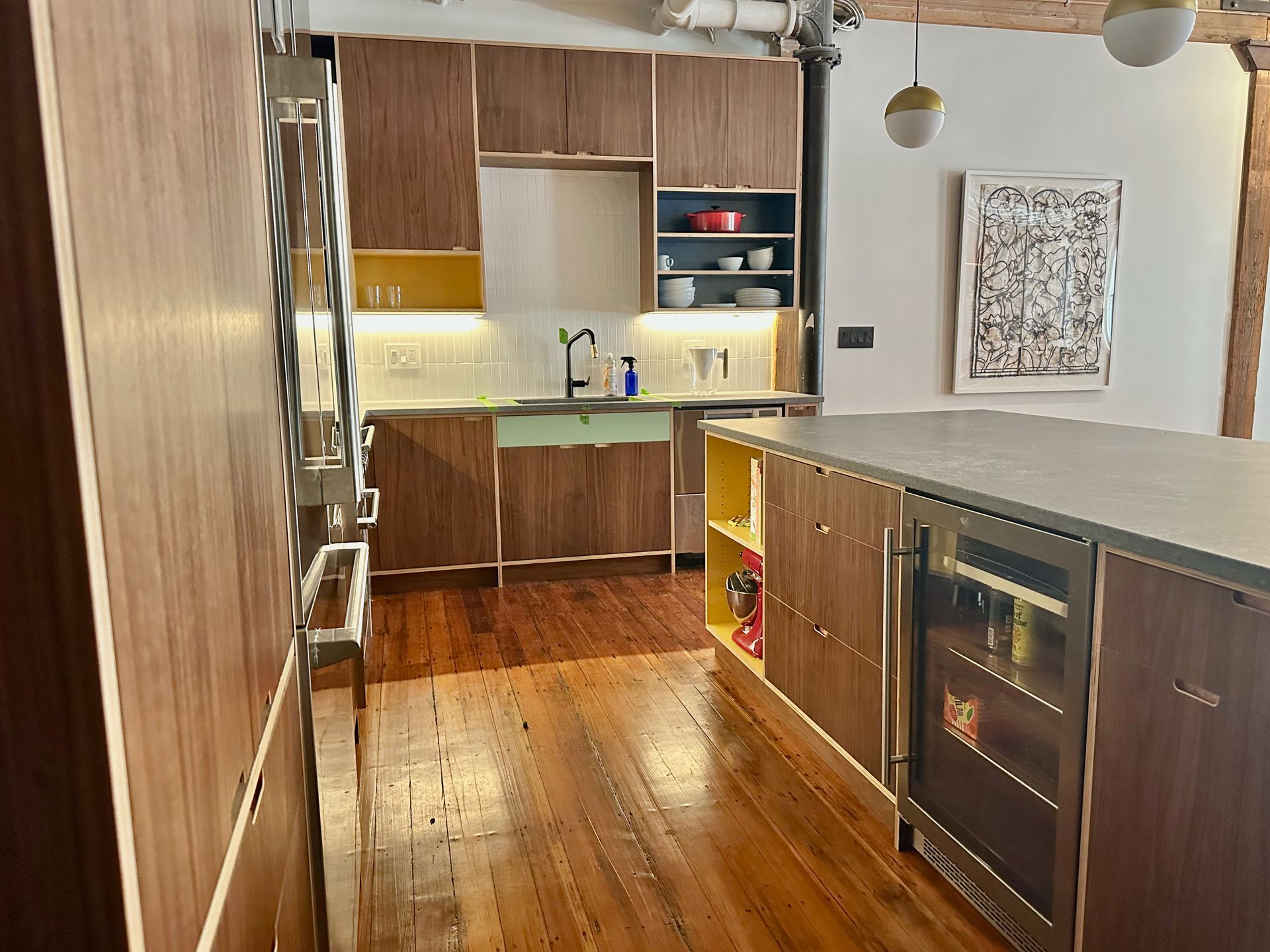 A kitchen with wooden cabinets and stainless steel appliances