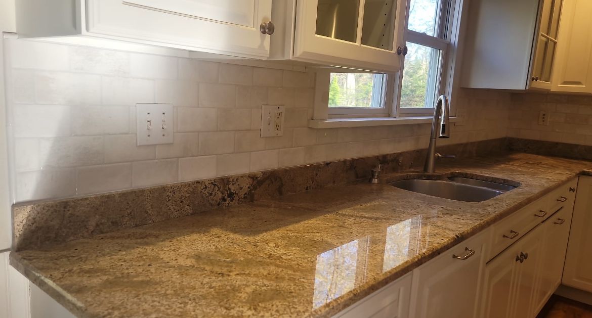 A kitchen with granite counter tops and a sink