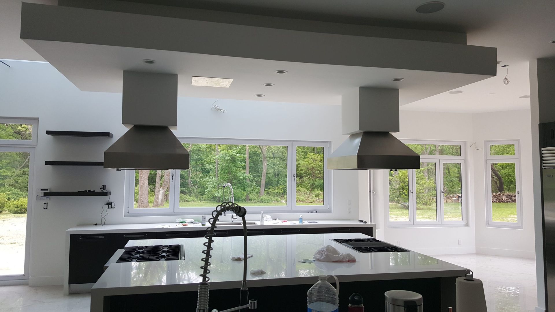 A kitchen with a stove top oven and a sink
