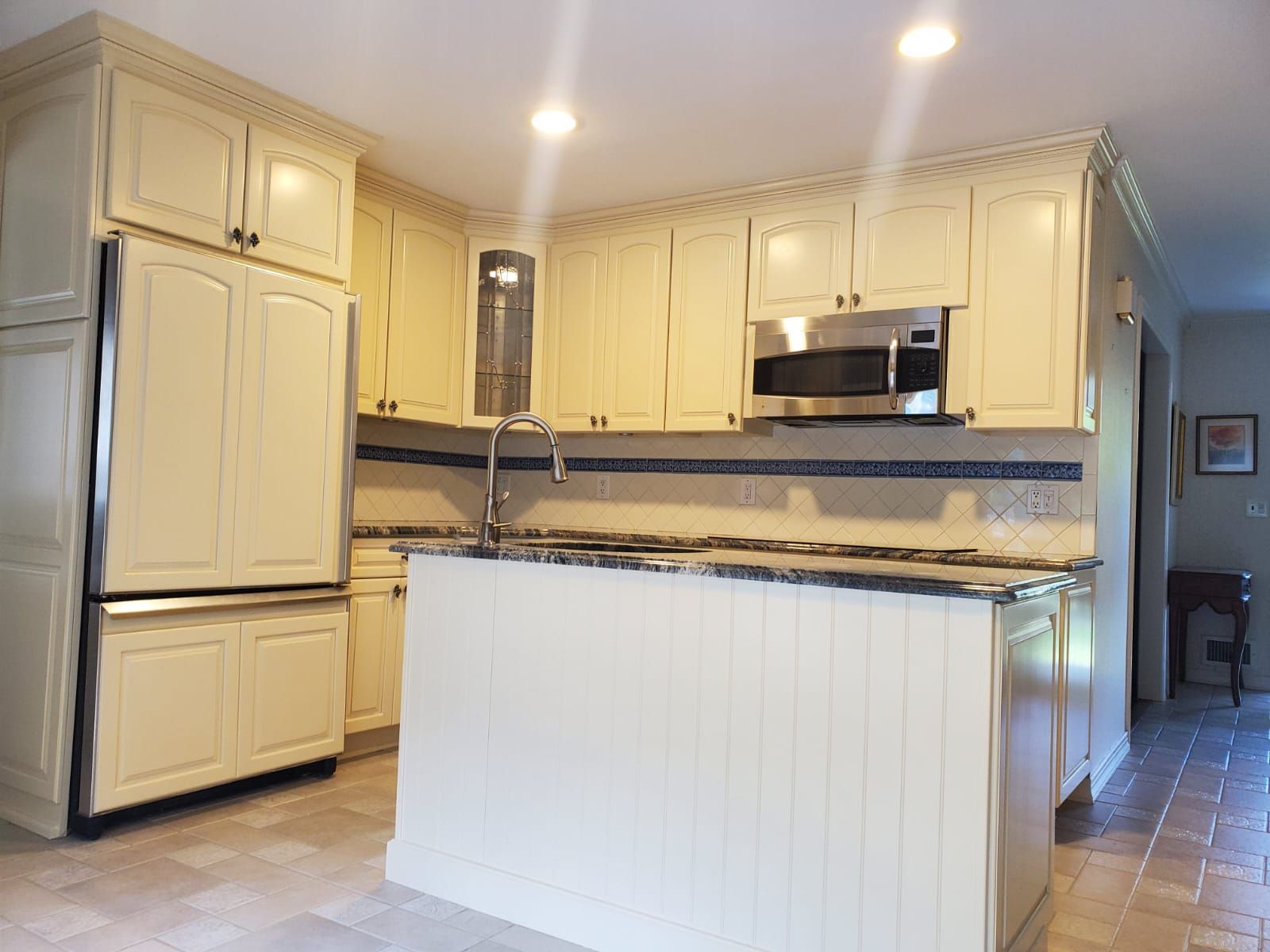 There is a large island in the middle of the kitchen.