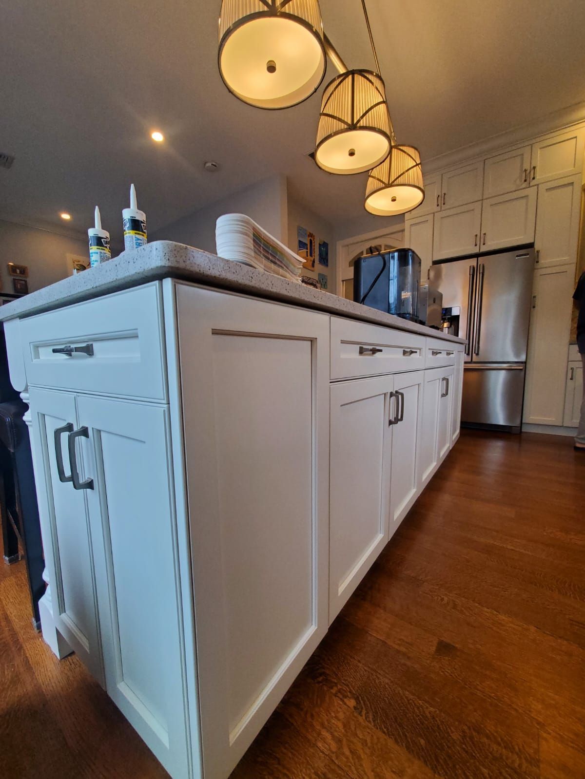A kitchen with white cabinets and stainless steel appliances.