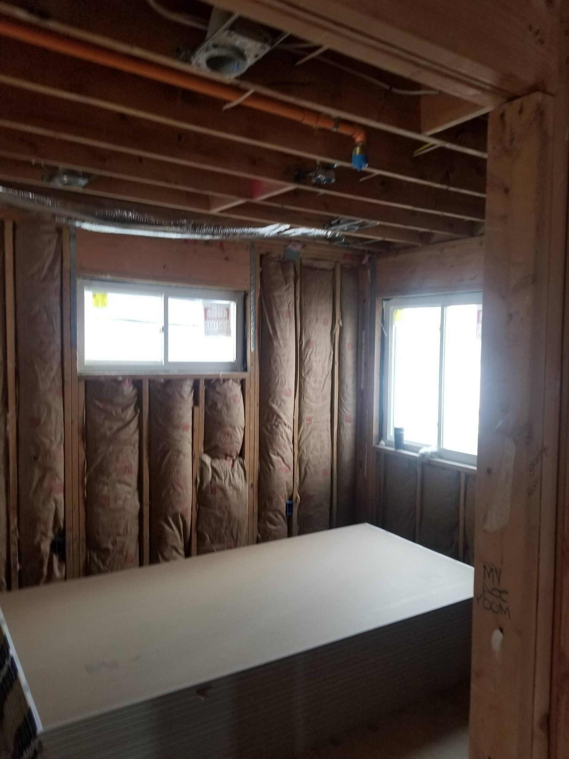 A room under construction with a large table in the middle