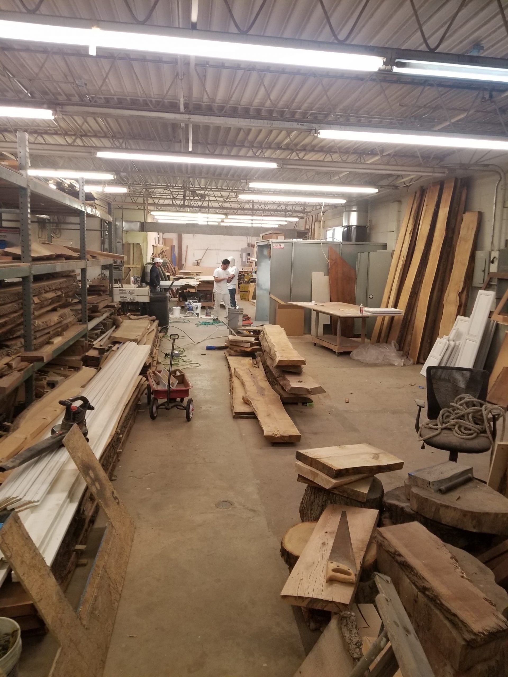 A large warehouse filled with lots of wooden pieces