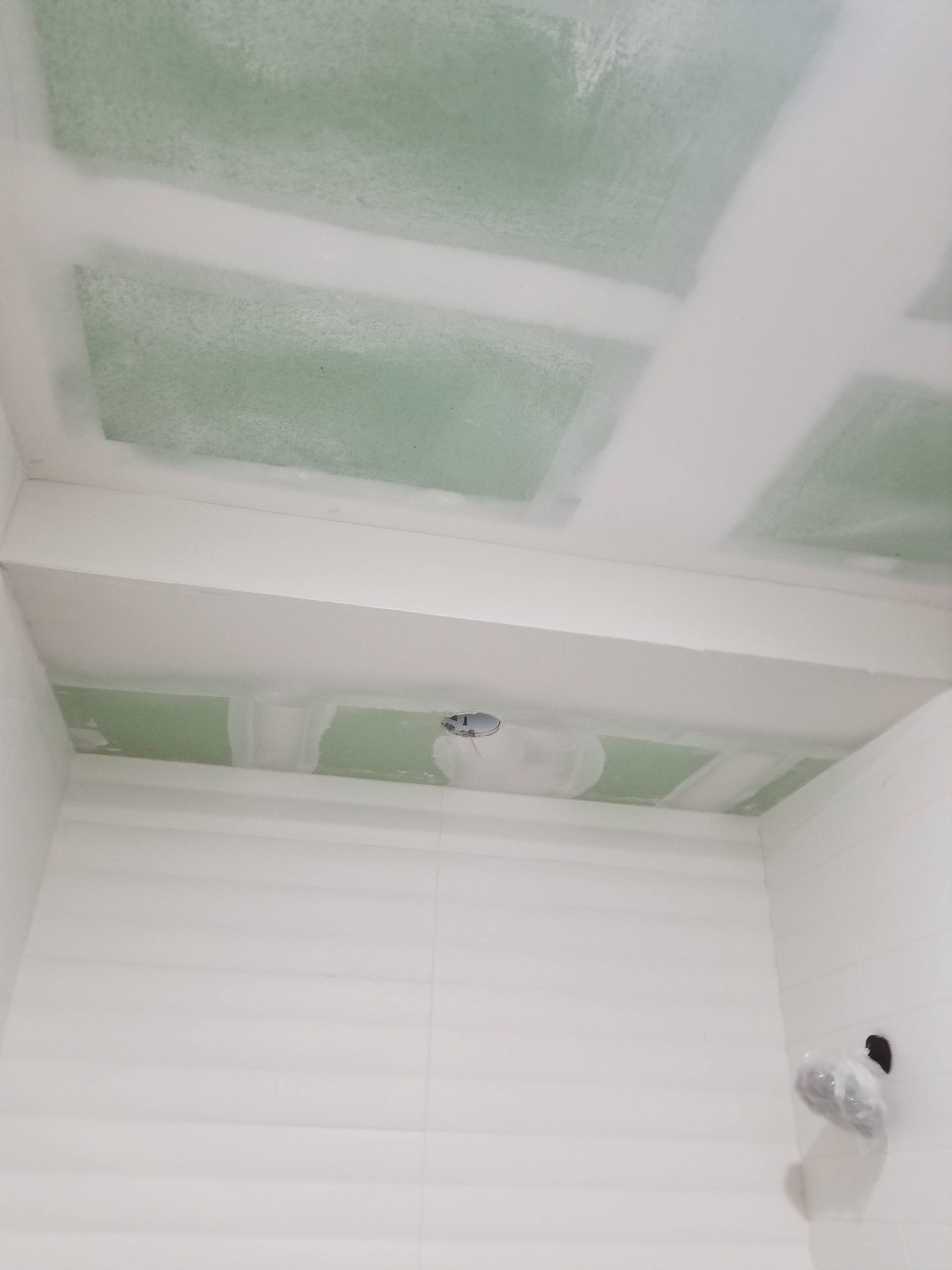 A room with a ceiling that is being remodeled.