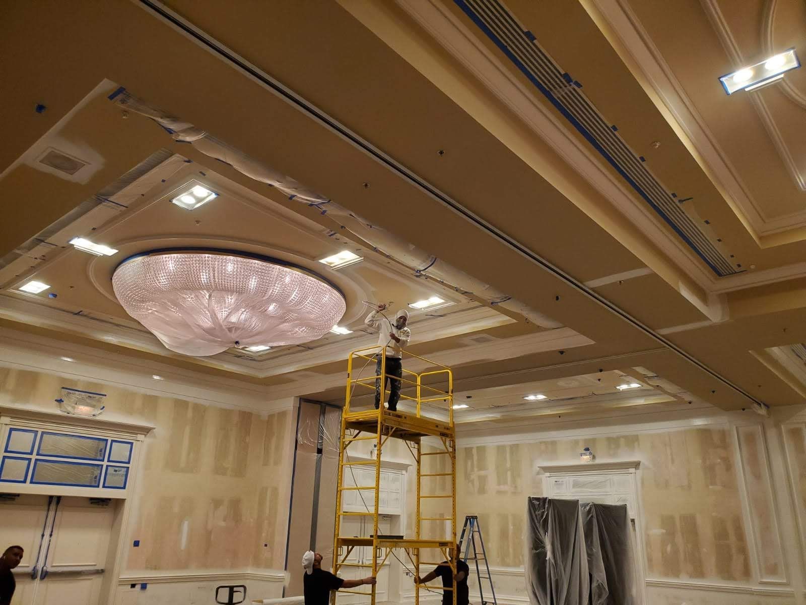 A large room with a large chandelier hanging from the ceiling.