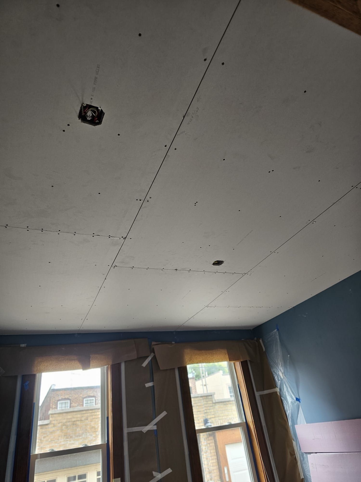 A room with a ceiling that has a hole in it