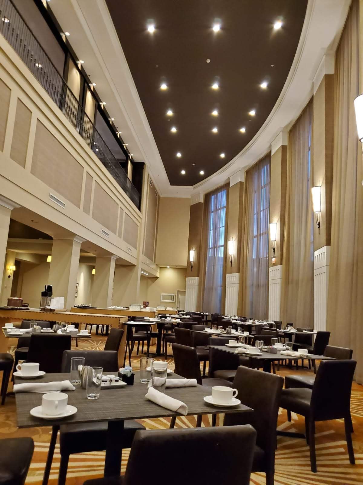 A large room with tables and chairs in it