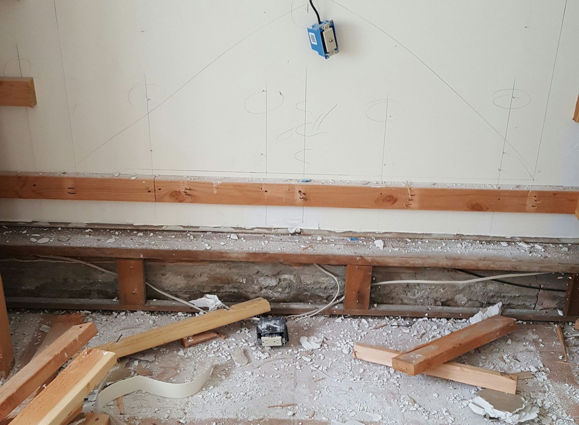 A room with a lot of wood and styrofoam on the floor