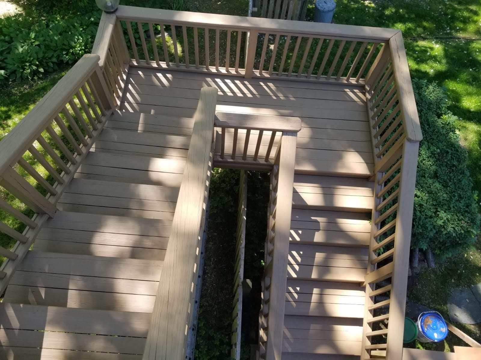 An aerial view of a wooden deck with stairs leading up to it.