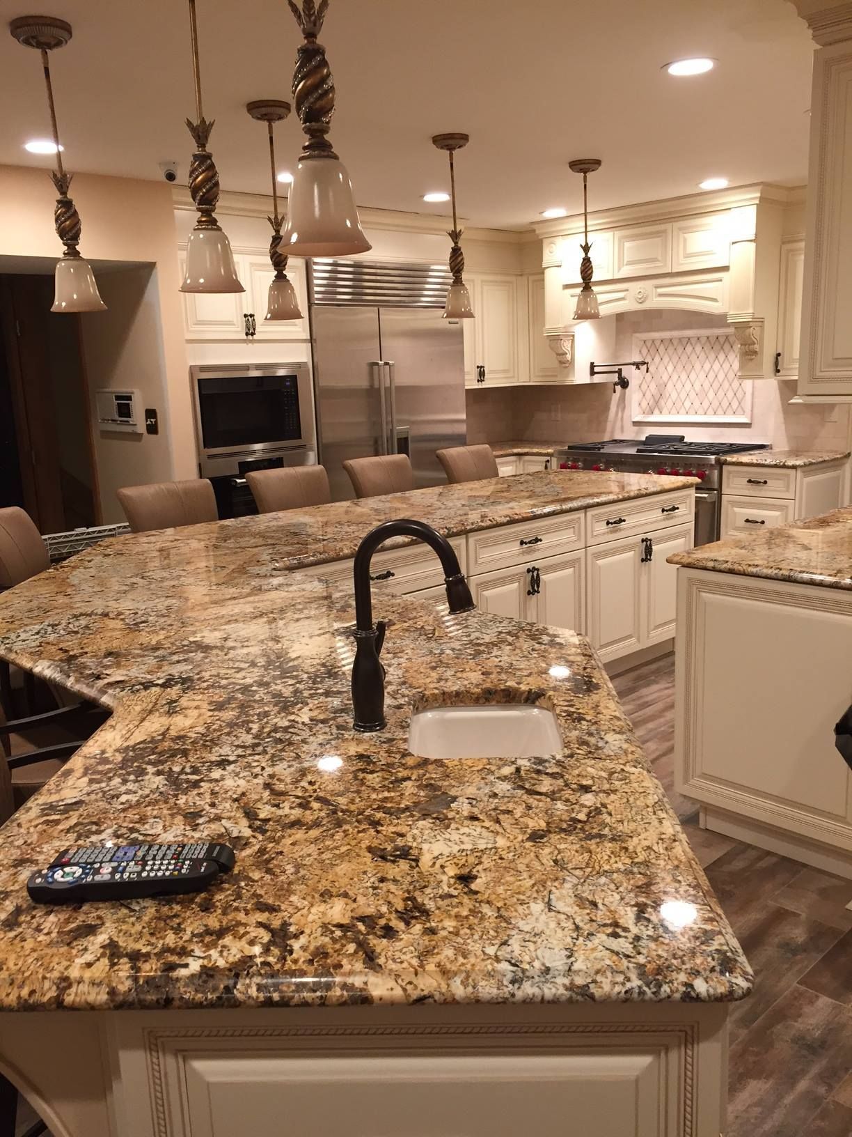 A kitchen with granite counter tops and a sink