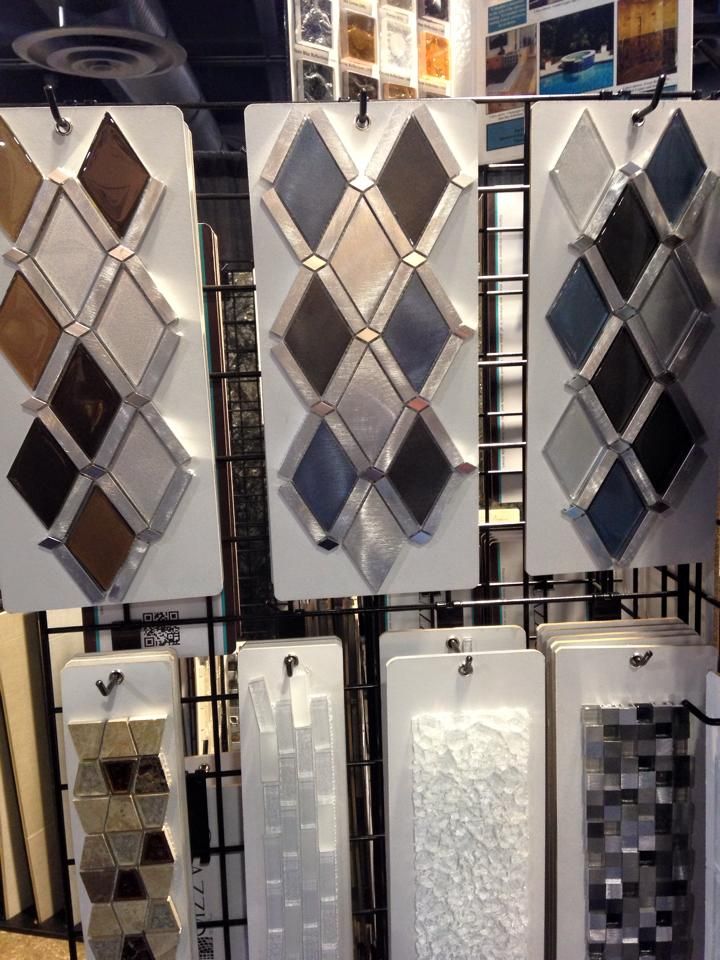 A variety of tiles are displayed on a rack in a store