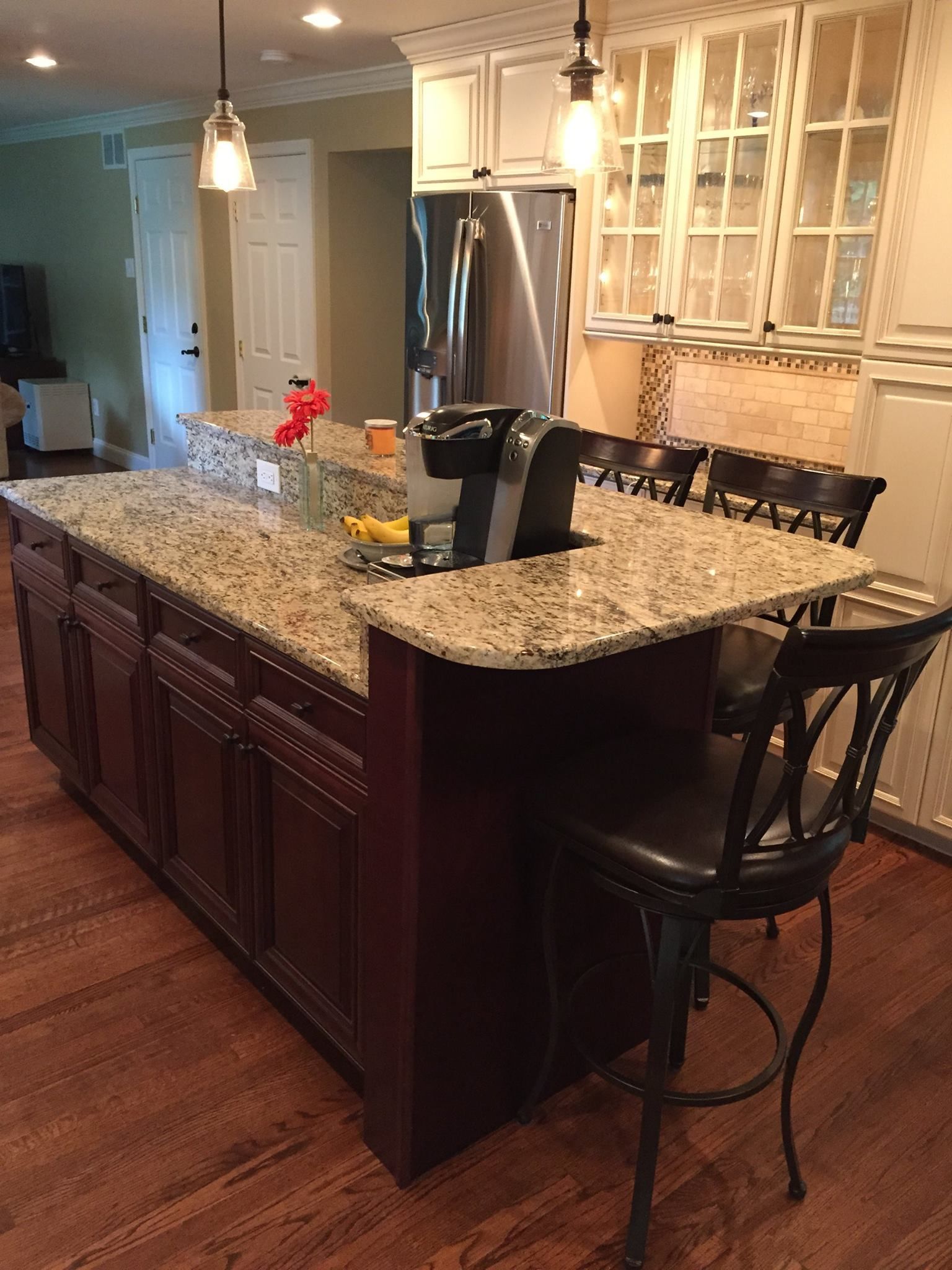 A kitchen with granite counter tops and stainless steel appliances