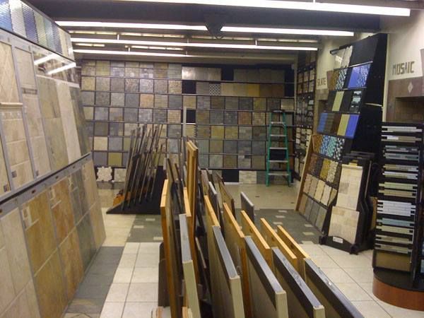 A store filled with lots of tiles and a ladder