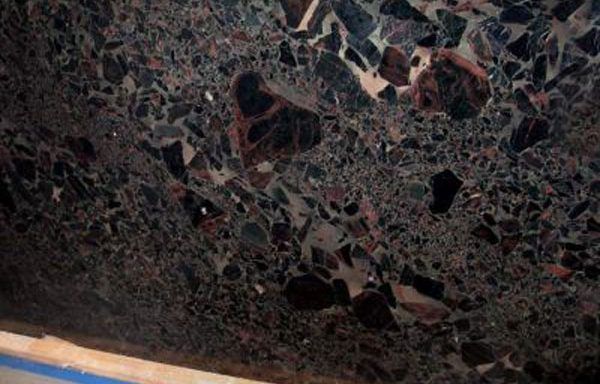 A close up of a black granite counter top.