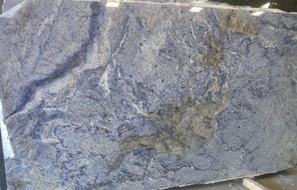 A large piece of blue granite is sitting on top of a table.