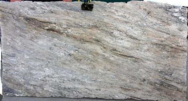 A person is holding a large piece of granite.