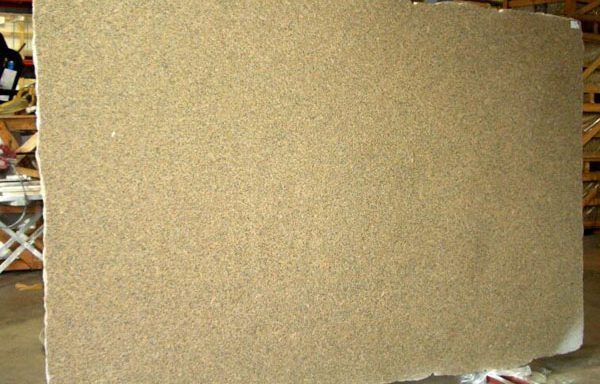 A large piece of cardboard is sitting on a table in a warehouse.