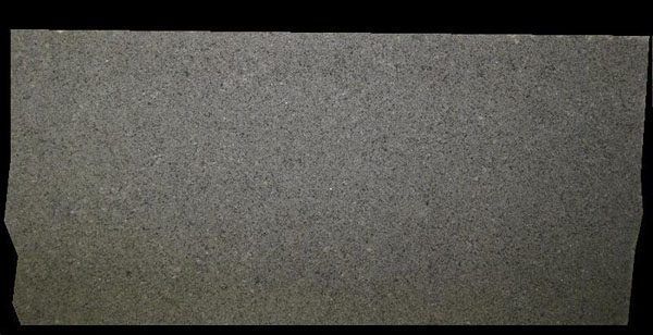 A close up of a piece of cardboard on a black background.