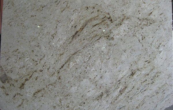 A close up of a white granite counter top.