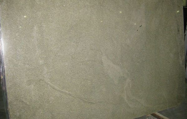 A large piece of marble is sitting on top of a table.