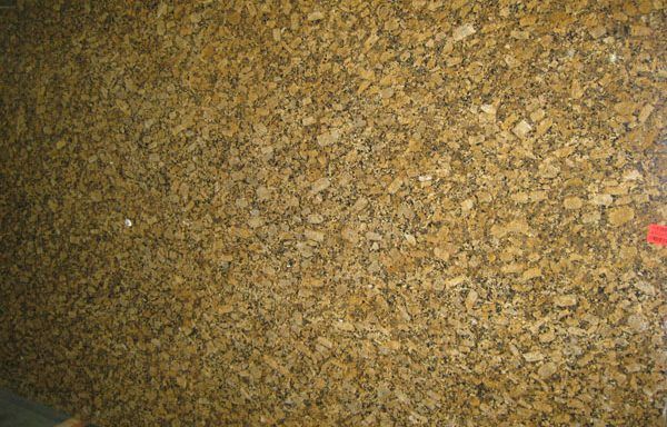 A pile of brown gravel is sitting on the ground.