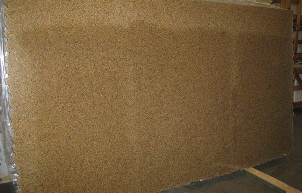 A large piece of wood is sitting on the floor in a room.