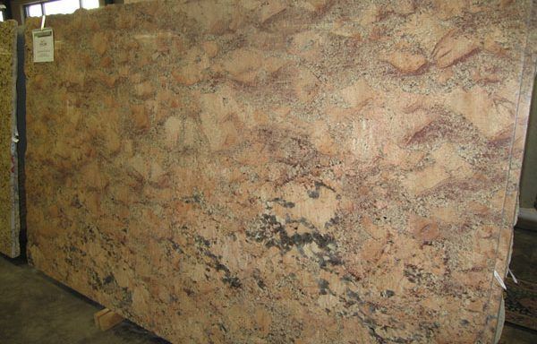 A large piece of granite is sitting on top of a wooden table.