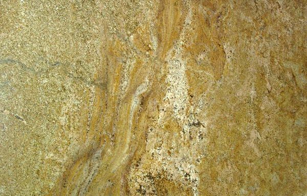 A close up of a yellow granite counter top.