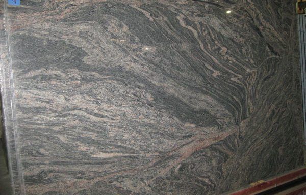 A close up of a granite slab sitting on top of a table.