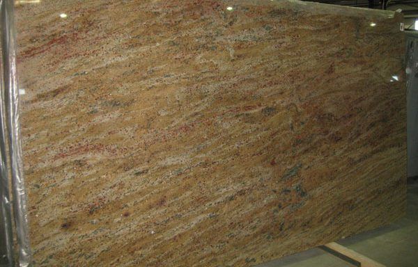 A large slab of granite is sitting on top of a wooden table.