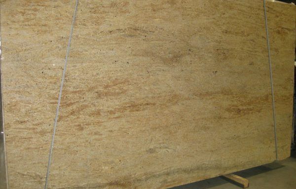 A large piece of plywood is sitting on top of a wooden pallet.