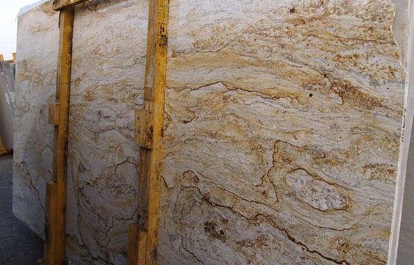 A large slab of marble is sitting on top of a wooden crate.