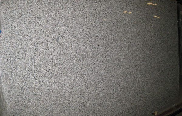 A large piece of granite is sitting on a table.