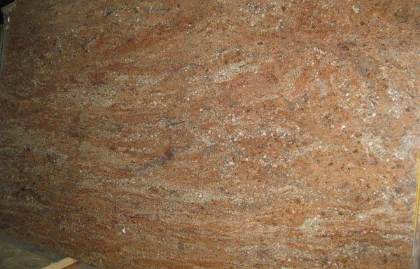 A close up of a piece of wood with a marble texture.