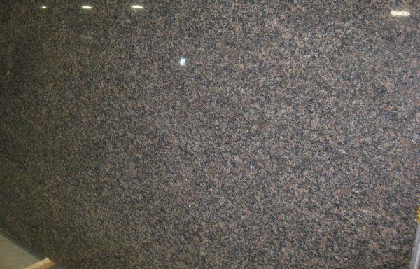 A large piece of granite is sitting on a table.