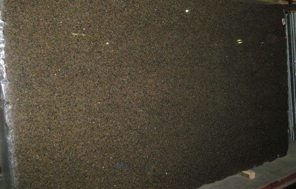 A large piece of black granite is sitting on a table.