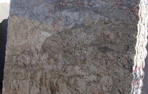 A close up of a piece of granite sitting on top of a table.