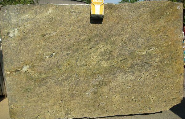 A large piece of stone is sitting on top of a wooden table.