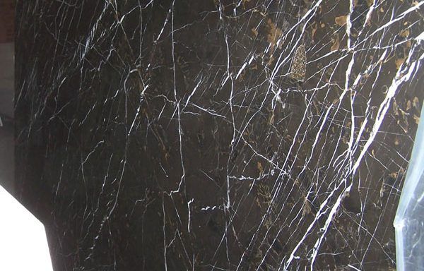 A close up of a black marble counter top